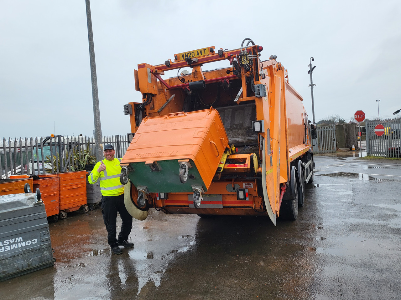 Commercial bin wagon in action with commercial bin operative